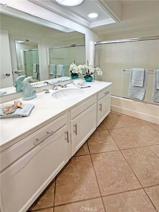 3525 Bahia Blanca W Unit B, Laguna Woods, CA 92637 - bathroom featuring vanity, tile patterned floors, combined bath / shower with glass door, and ornamental molding