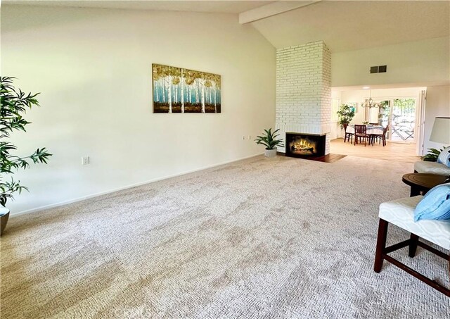 3525 Bahia Blanca W Unit B, Laguna Woods, CA 92637 - carpeted living room with beamed ceiling, high vaulted ceiling, and a fireplace