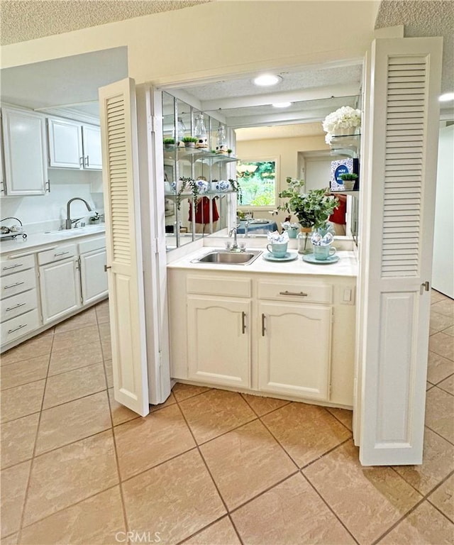 3525 Bahia Blanca W Unit B, Laguna Woods, CA 92637 - bar area with light tile patterned flooring and a textured ceiling