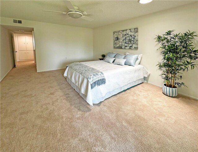 3525 Bahia Blanca W Unit B, Laguna Woods, CA 92637 - bedroom with carpet floors, a ceiling fan, and a textured ceiling