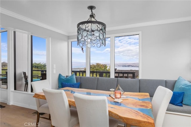 329 Travis Dr, Los Osos, CA 93402 - dining space featuring a chandelier, ornamental molding, and wood finished floors
