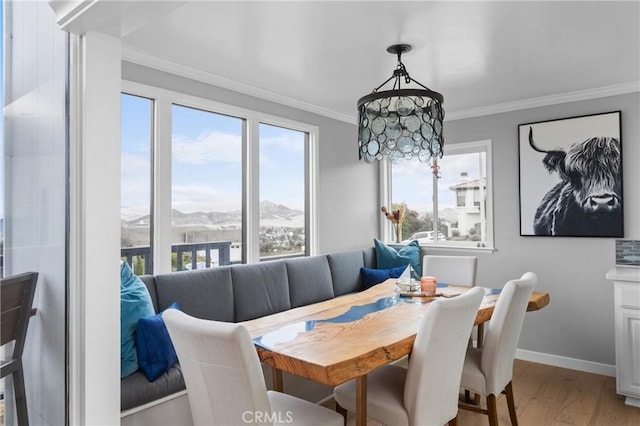 329 Travis Dr, Los Osos, CA 93402 - dining area featuring crown molding, light wood-style floors, and a mountain view