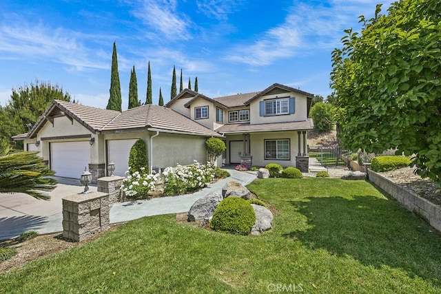 2504 Martingail Dr, Covina, CA 91724 - view of front facade featuring stucco siding, concrete driveway, a garage, and a porch