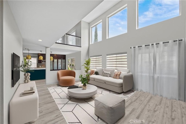 2504 Martingail Dr, Covina, CA 91724 - living room featuring wood finished floors, healthy amount of natural light, and a high ceiling