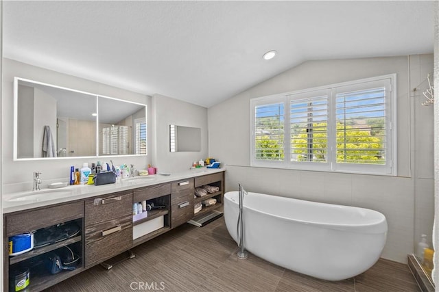 2504 Martingail Dr, Covina, CA 91724 - full bathroom featuring double vanity, a freestanding bath, vaulted ceiling, a shower, and recessed lighting