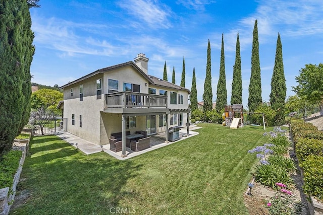 2504 Martingail Dr, Covina, CA 91724 - back of house with a patio, stucco siding, a chimney, a playground, and a deck