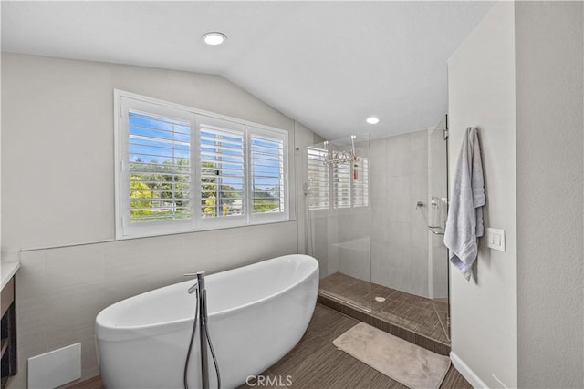 2504 Martingail Dr, Covina, CA 91724 - bathroom with a soaking tub, lofted ceiling, a shower stall, vanity, and wood finished floors