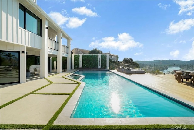 32075 Canterhill Pl, Westlake Village, CA 91361 - view of pool with a mountain view, a pool with connected hot tub, and a patio area