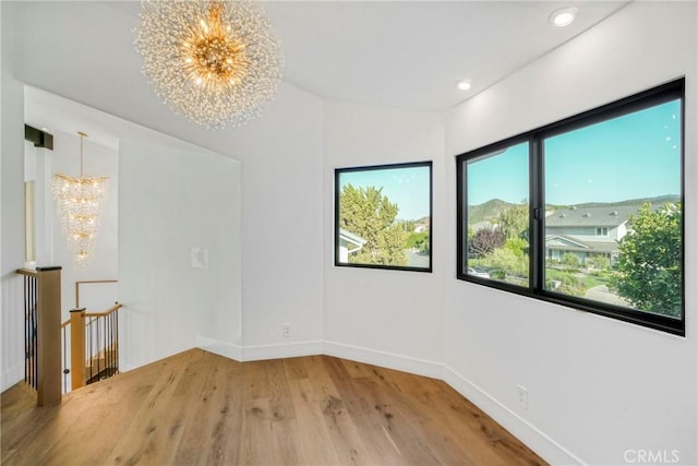 32075 Canterhill Pl, Westlake Village, CA 91361 - empty room with a chandelier, light wood finished floors, and recessed lighting