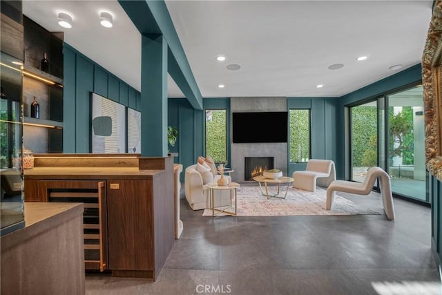 32075 Canterhill Pl, Westlake Village, CA 91361 - living area with a fireplace, wine cooler, finished concrete floors, and recessed lighting