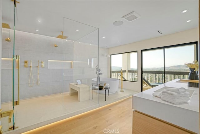 32075 Canterhill Pl, Westlake Village, CA 91361 - full bath with a tile shower, wood finished floors, a freestanding tub, recessed lighting, and vanity