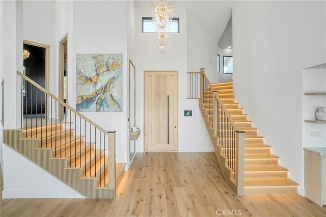 32075 Canterhill Pl, Westlake Village, CA 91361 - entryway featuring stairs, a high ceiling, a chandelier, and wood finished floors