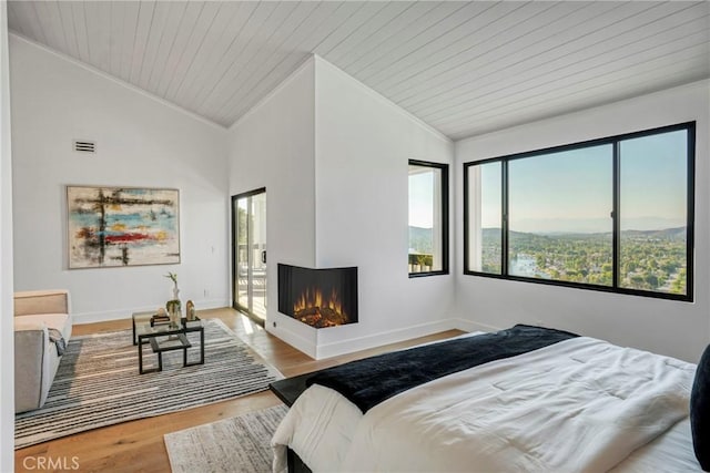 32075 Canterhill Pl, Westlake Village, CA 91361 - bedroom with vaulted ceiling, a multi sided fireplace, wood finished floors, and wooden ceiling