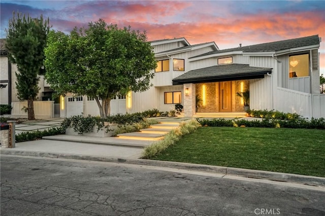 32075 Canterhill Pl, Westlake Village, CA 91361 - view of front of home with a garage, a lawn, board and batten siding, driveway, and roof with shingles