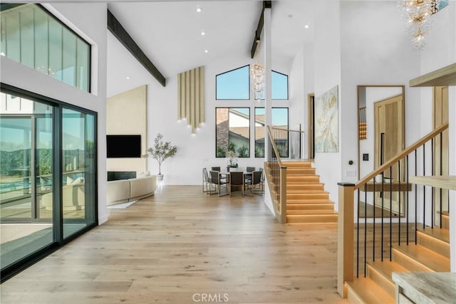 32075 Canterhill Pl, Westlake Village, CA 91361 - stairway with high vaulted ceiling, wood finished floors, a chandelier, beam ceiling, and plenty of natural light