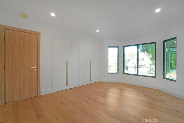 32075 Canterhill Pl, Westlake Village, CA 91361 - unfurnished bedroom featuring multiple closets, light wood-style floors, and recessed lighting