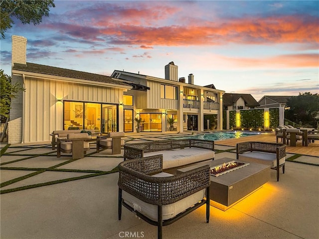 32075 Canterhill Pl, Westlake Village, CA 91361 - patio / terrace with an outdoor living space with a fire pit, a patio, and an outdoor pool