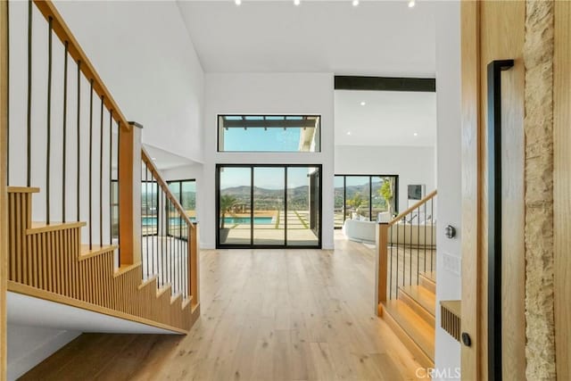 32075 Canterhill Pl, Westlake Village, CA 91361 - hall with wood finished floors, stairs, a mountain view, and a high ceiling