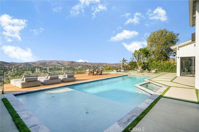 32075 Canterhill Pl, Westlake Village, CA 91361 - view of pool with a mountain view, a pool with connected hot tub, and a patio area
