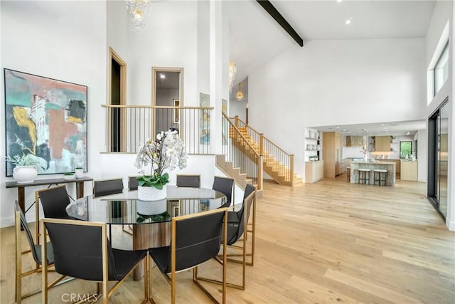 32075 Canterhill Pl, Westlake Village, CA 91361 - dining room with high vaulted ceiling, light wood-type flooring, beamed ceiling, stairway, and healthy amount of natural light