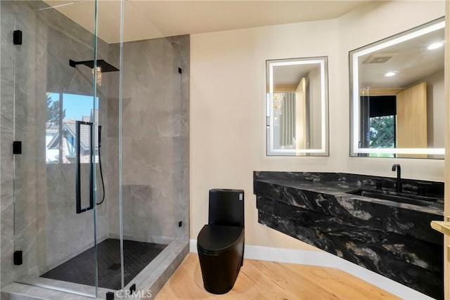 32075 Canterhill Pl, Westlake Village, CA 91361 - bathroom featuring healthy amount of natural light, vanity, a shower stall, wood finished floors, and recessed lighting