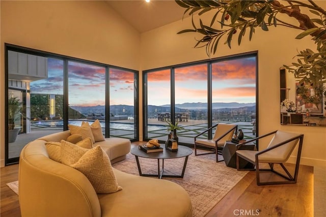32075 Canterhill Pl, Westlake Village, CA 91361 - living room with wood finished floors, plenty of natural light, a mountain view, and high vaulted ceiling