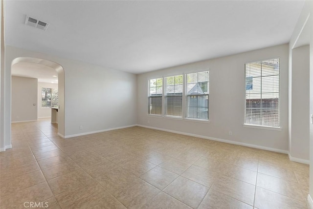 29184 Stone Ridge St, Menifee, CA 92584 - spare room with arched walkways and light tile patterned flooring