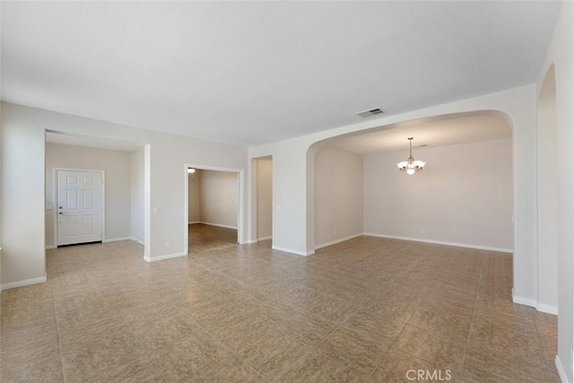29184 Stone Ridge St, Menifee, CA 92584 - empty room featuring arched walkways and a chandelier
