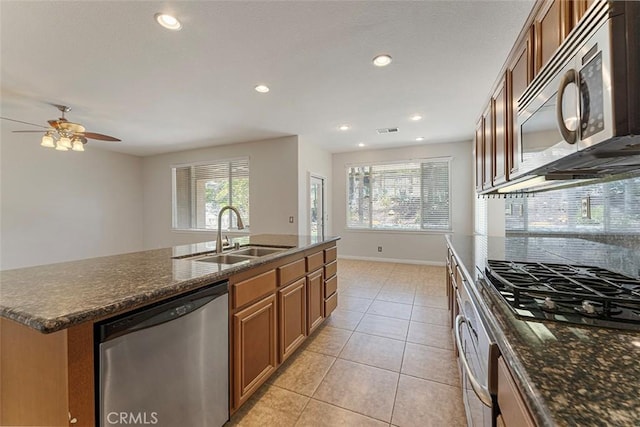 29184 Stone Ridge St, Menifee, CA 92584 - kitchen with appliances with stainless steel finishes, healthy amount of natural light, brown cabinetry, and recessed lighting