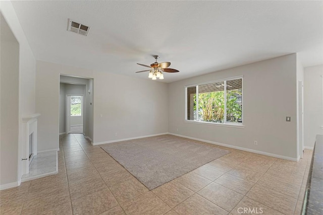 29184 Stone Ridge St, Menifee, CA 92584 - spare room featuring healthy amount of natural light, a ceiling fan, and light tile patterned flooring