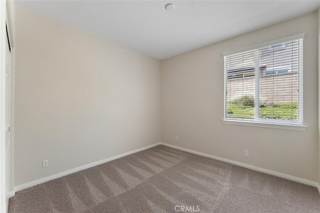 29184 Stone Ridge St, Menifee, CA 92584 - carpeted empty room featuring baseboards