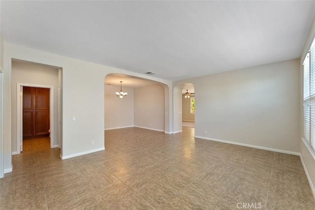 29184 Stone Ridge St, Menifee, CA 92584 - spare room featuring arched walkways and a chandelier