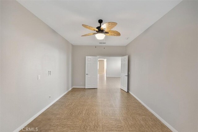 29184 Stone Ridge St, Menifee, CA 92584 - spare room featuring a ceiling fan and arched walkways
