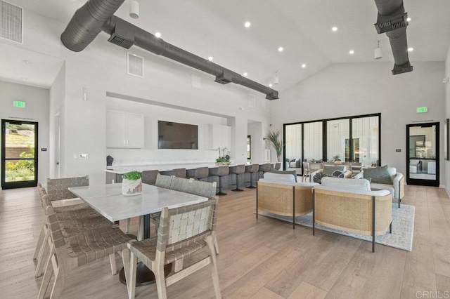 12639 Elizabeth Way, San Diego, CA 92129 - dining area with high vaulted ceiling, light wood-style flooring, and recessed lighting
