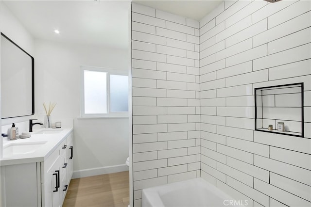 4561 Beverly Ct, Riverside, CA 92506 - full bath featuring double vanity, wood finished floors, and shower / washtub combination