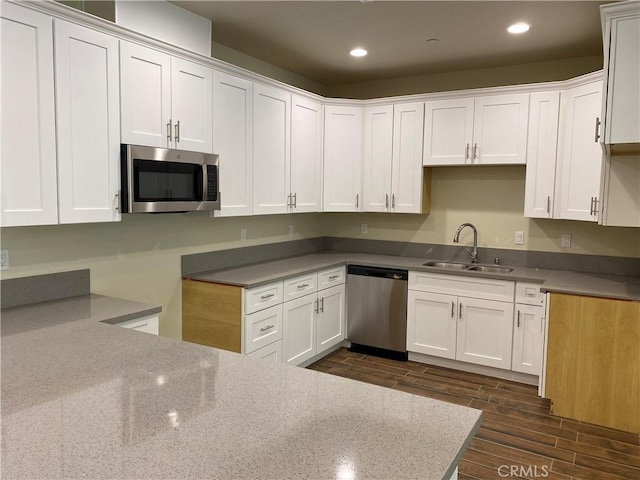 13236 El Rio Ln, Desert Hot Springs, CA 92240 - kitchen featuring stainless steel appliances, light stone counters, dark wood-style floors, recessed lighting, and white cabinets