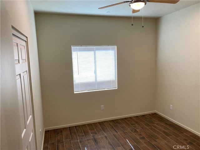 13236 El Rio Ln, Desert Hot Springs, CA 92240 - empty room with a ceiling fan and dark wood-style flooring