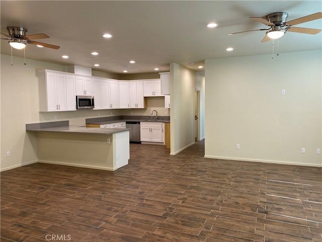13236 El Rio Ln, Desert Hot Springs, CA 92240 - kitchen with stainless steel appliances, ceiling fan, dark wood-type flooring, a peninsula, and recessed lighting