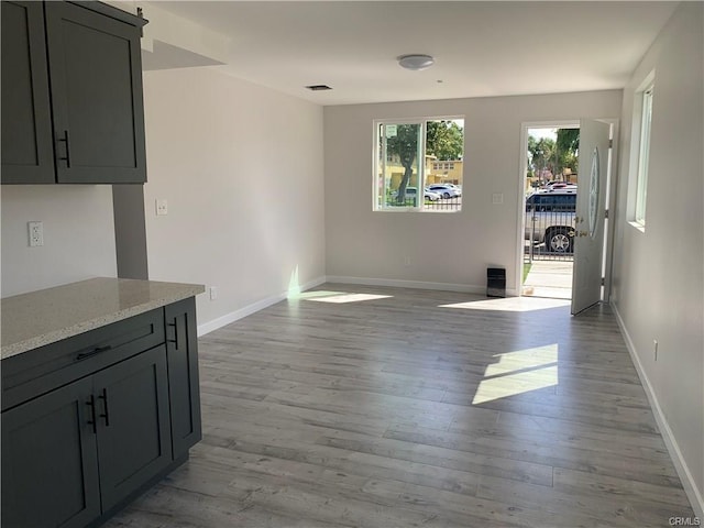 1539 112th St, Los Angeles, CA 90059 - unfurnished living room with wood finished floors and baseboards