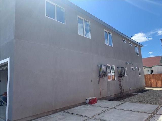 1539 112th St, Los Angeles, CA 90059 - view of side of home with a patio area and stucco siding
