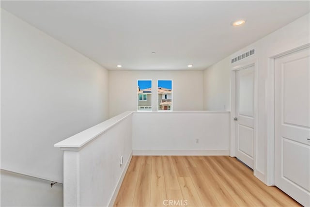 16707 Island Oak St, Fontana, CA 92336 - corridor with an upstairs landing, recessed lighting, and light wood-style flooring