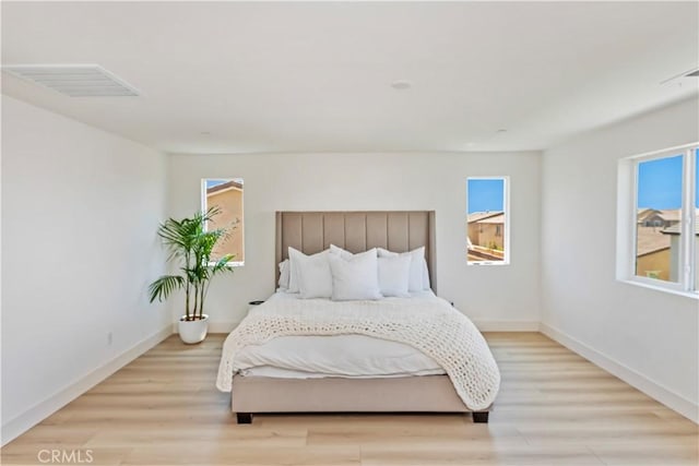 16707 Island Oak St, Fontana, CA 92336 - bedroom with light wood-style flooring and baseboards