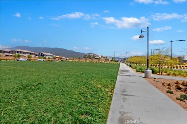 16707 Island Oak St, Fontana, CA 92336 - view of property's community with a yard and a mountain view