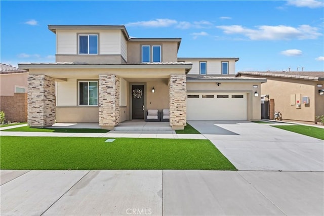 16707 Island Oak St, Fontana, CA 92336 - view of front of home with stucco siding, driveway, a front lawn, and a porch