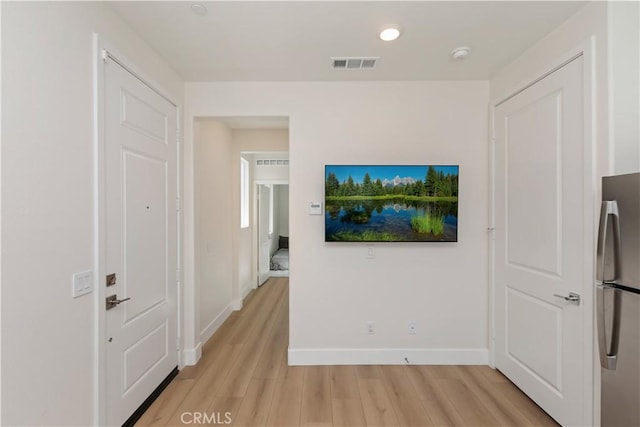 16707 Island Oak St, Fontana, CA 92336 - corridor featuring light wood-style flooring and baseboards