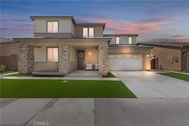 16707 Island Oak St, Fontana, CA 92336 - view of front facade featuring a garage, concrete driveway, a porch, stucco siding, and a yard
