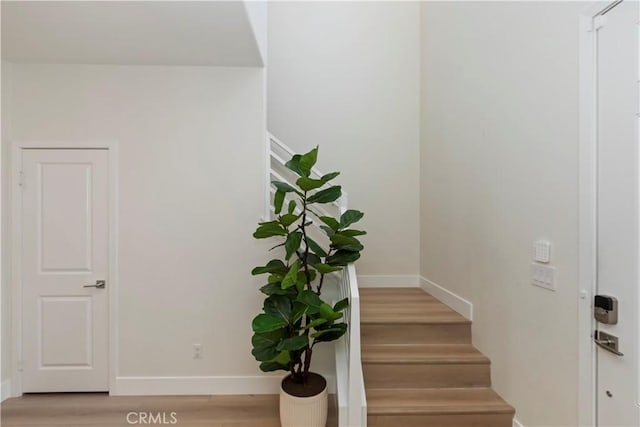 16707 Island Oak St, Fontana, CA 92336 - staircase with wood finished floors and baseboards