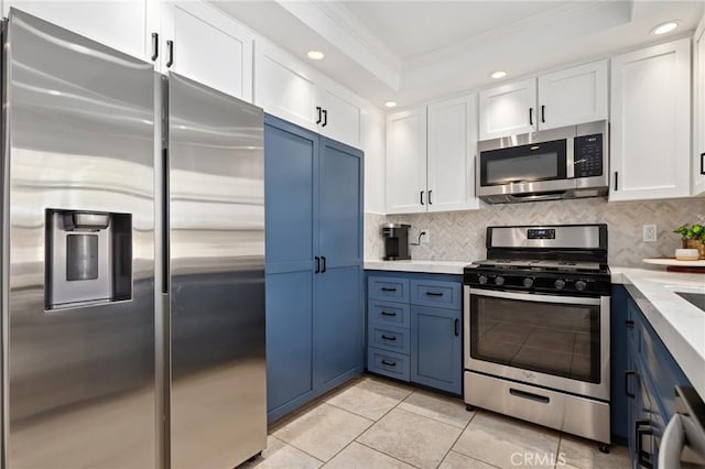 14 Black Oak, Irvine, CA 92604 - kitchen featuring appliances with stainless steel finishes, ornamental molding, white cabinetry, backsplash, and light tile patterned floors