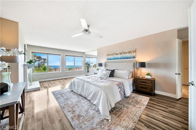 15 Vista Del Ponto Unit 70, San Clemente, CA 92672 - bedroom with a textured ceiling, wood finished floors, and ceiling fan