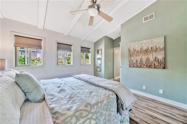 15 Vista Del Ponto Unit 70, San Clemente, CA 92672 - bedroom featuring multiple windows, wood finished floors, a textured ceiling, and ceiling fan